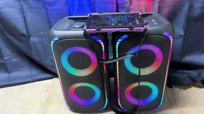 Onn Large Party Speaker Gen 2 lit up outdoors with LED lighting at a backyard gathering